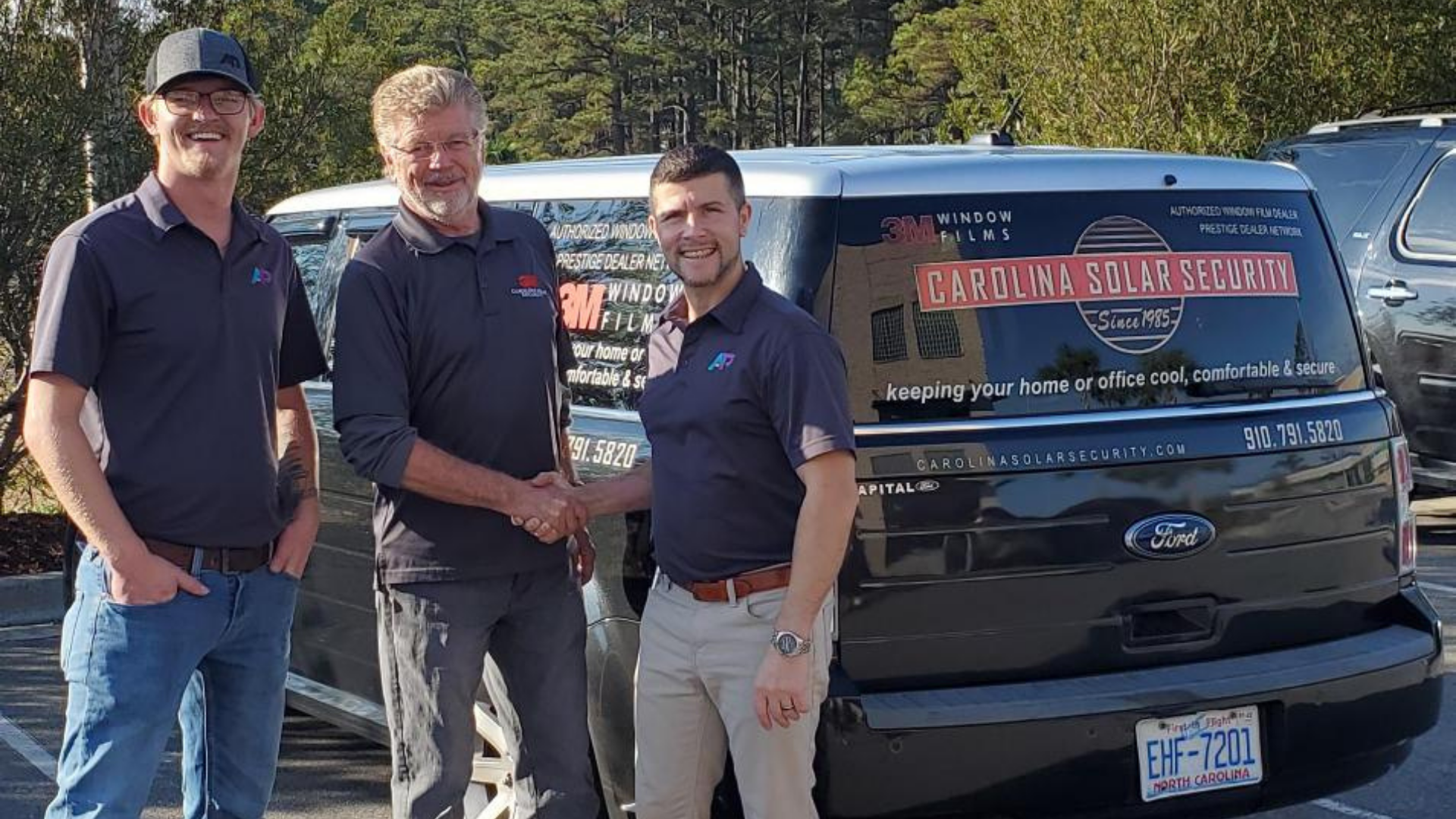 AP Corp's CEO Bill Valway and NC General Manager Luke McLawhorn meet with John Norwood, former owner of Carolina Solar Security, to finalize acquisition